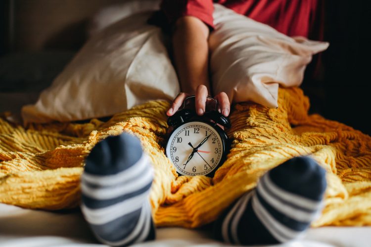 Alarm clock on the bed