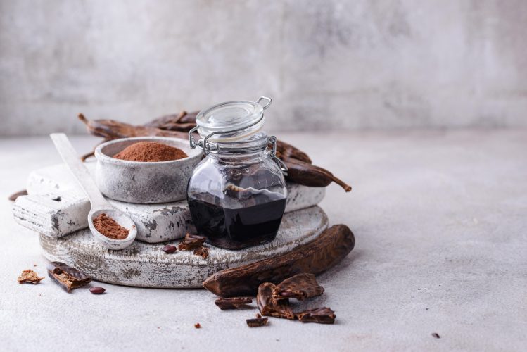 Carob pods, powder and molasses or syrup