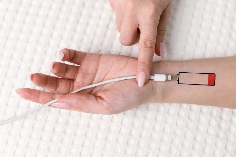 Low battery symbol drawn on human hand, living energy concept