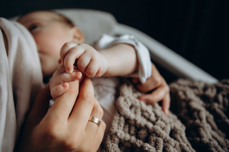mother breastfeeds baby