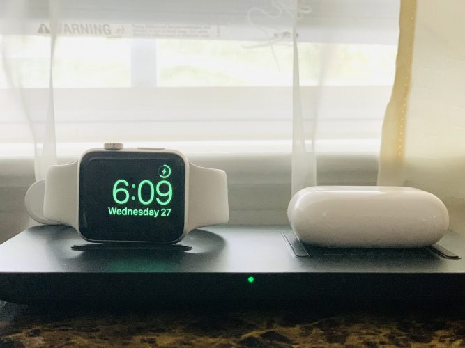 Technology watch and AirPods charging wirelessly
