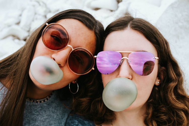 Teens blowing bubbles
