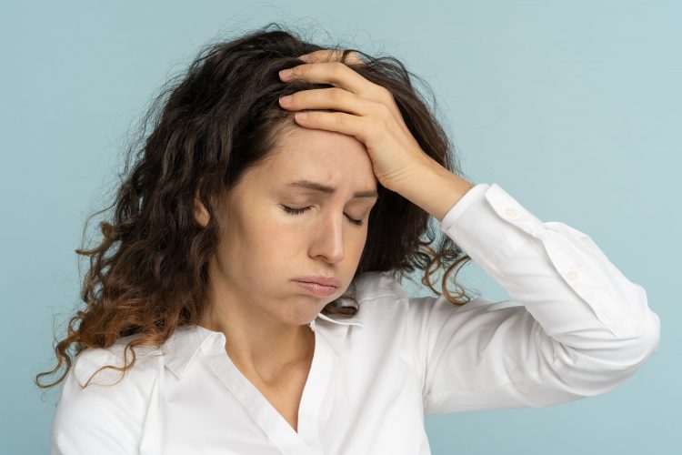 tired frustrated business woman office worker sighing wiping sweat of forehead has emotional burnout