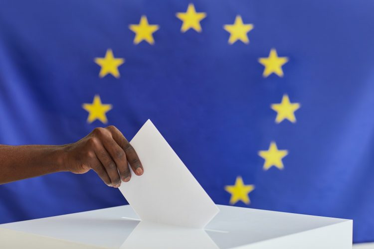 Man voting in voting booth