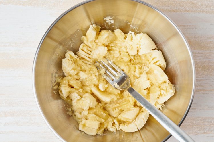 Mashed banana. Step by step recipe. Homemade Banana bread. Top view, wooden table.