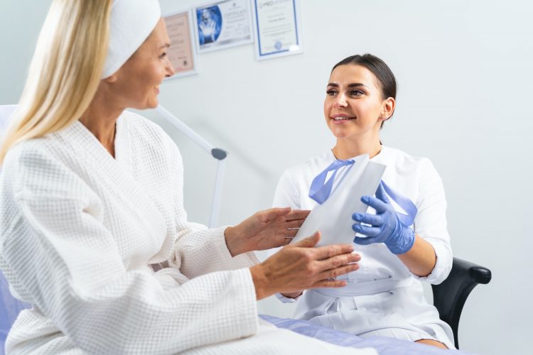 Patient with a paper bag looking at her dermatologist