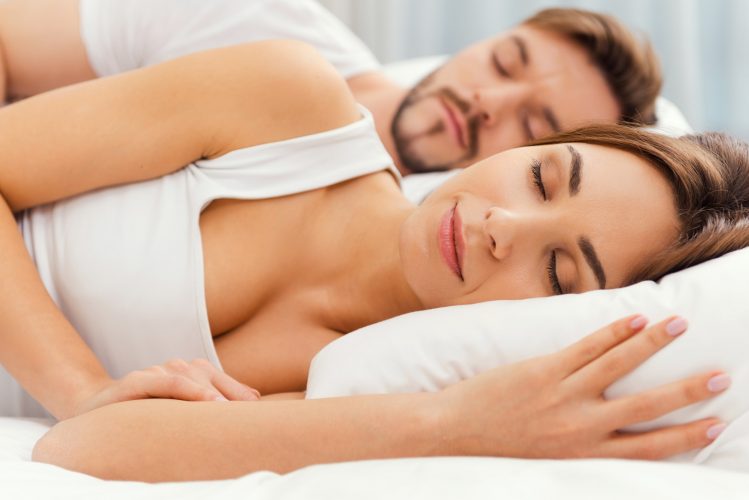 Sweet dreams. Beautiful young loving couple sleeping together in bed
