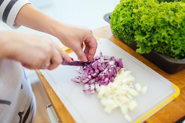Woman chopping onions