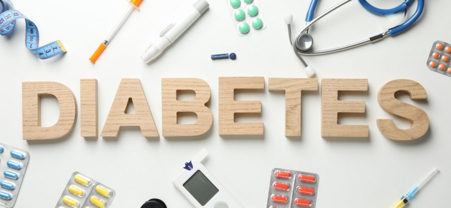 Word Diabetes made of wooden letters on white background. Diabetes accessories