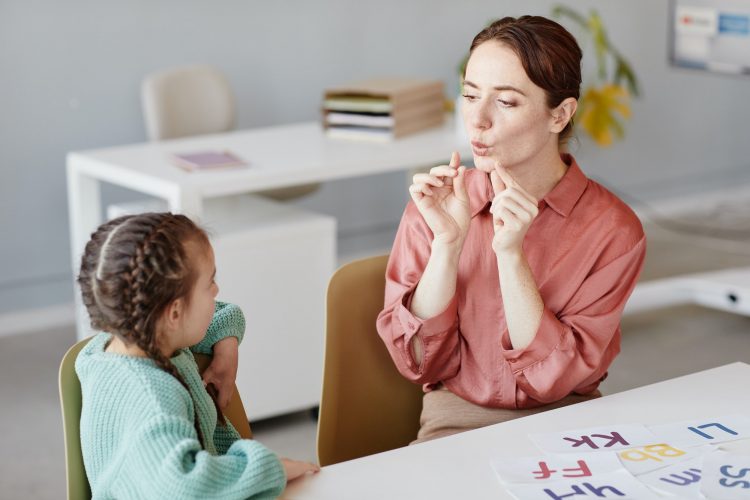 English teacher teaching to pronunciate the words
