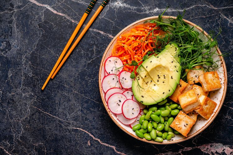 Buddha bowl asian salad with tofu cheese.