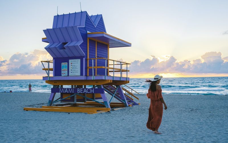 Miami beach, couple on the beach at Miami beach, life guard hut Miami beach Florida