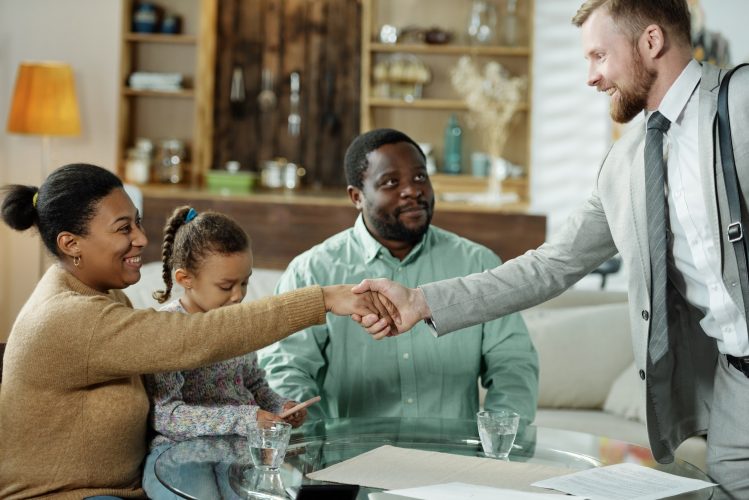 Friendly consultant meeting with ethnic family