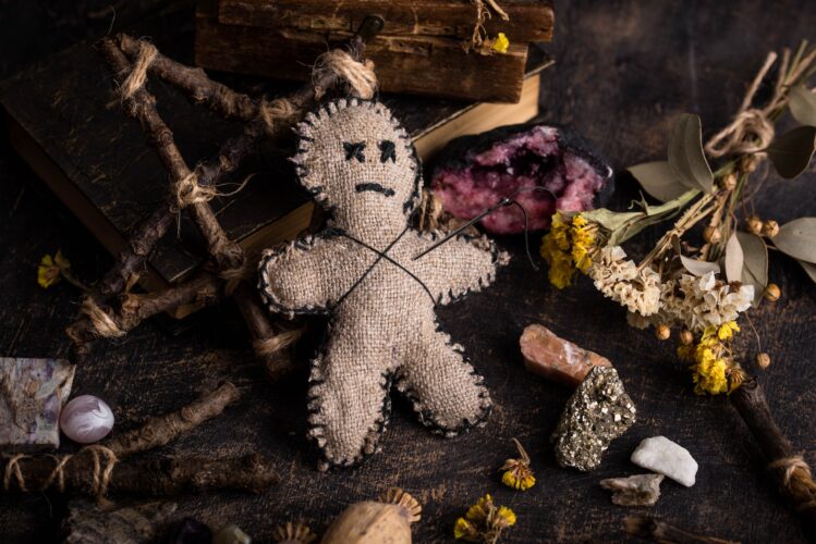 Voodoo doll. Black magic esoteric ritual. Halloween concept.