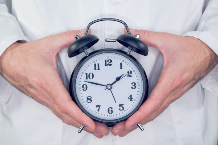 Doctor with alarm clock