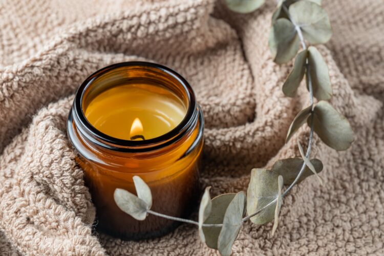 aroma candle in brown glass jar. Scented handmade candle. Soy candles are burning in a jar. Aroma