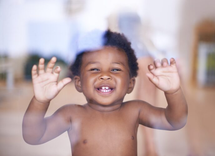 Im ready to go outside and play now. Shot of a cute baby boy looking through a window.