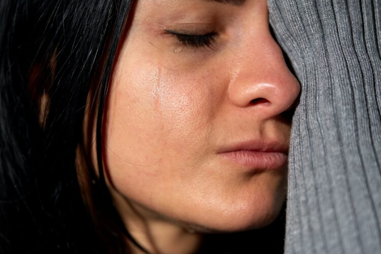 close up of unhappy crying woman