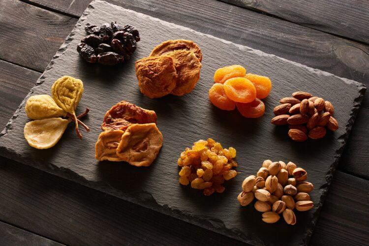 Dried fruits and nuts on slate plate