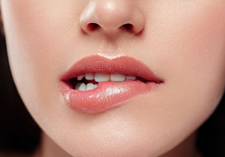 Woman lips mouth biting lip