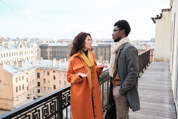 Young couple talking outdoors