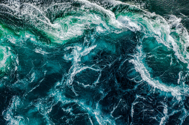 Waves of water of the river and the sea meet each other during high tide and low tide.