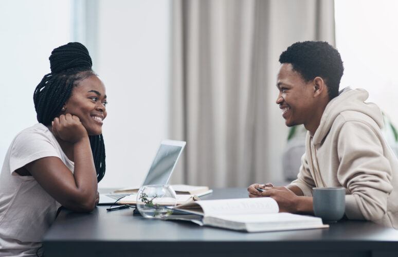 When your crush turns into your coworker. Shot of a happy young couple working from home.