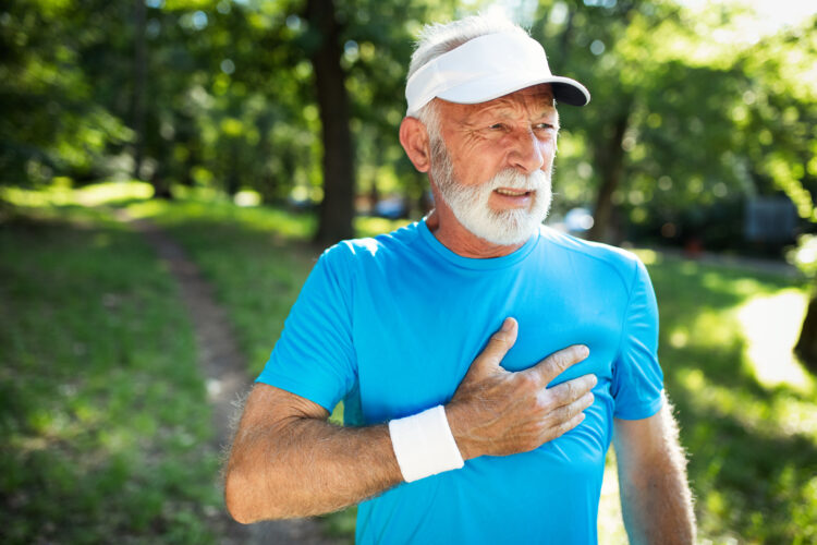 Mature man exercising outdoors to prevent cardiovascular diseases and heart attack