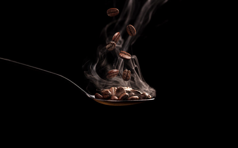 Spoon with coffee beans