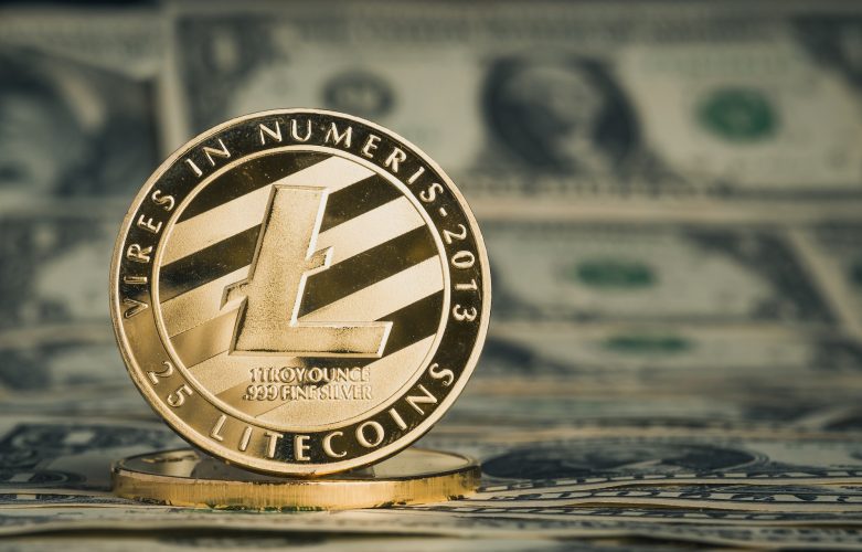 crypto currency gold litecoin on dollar banknote background